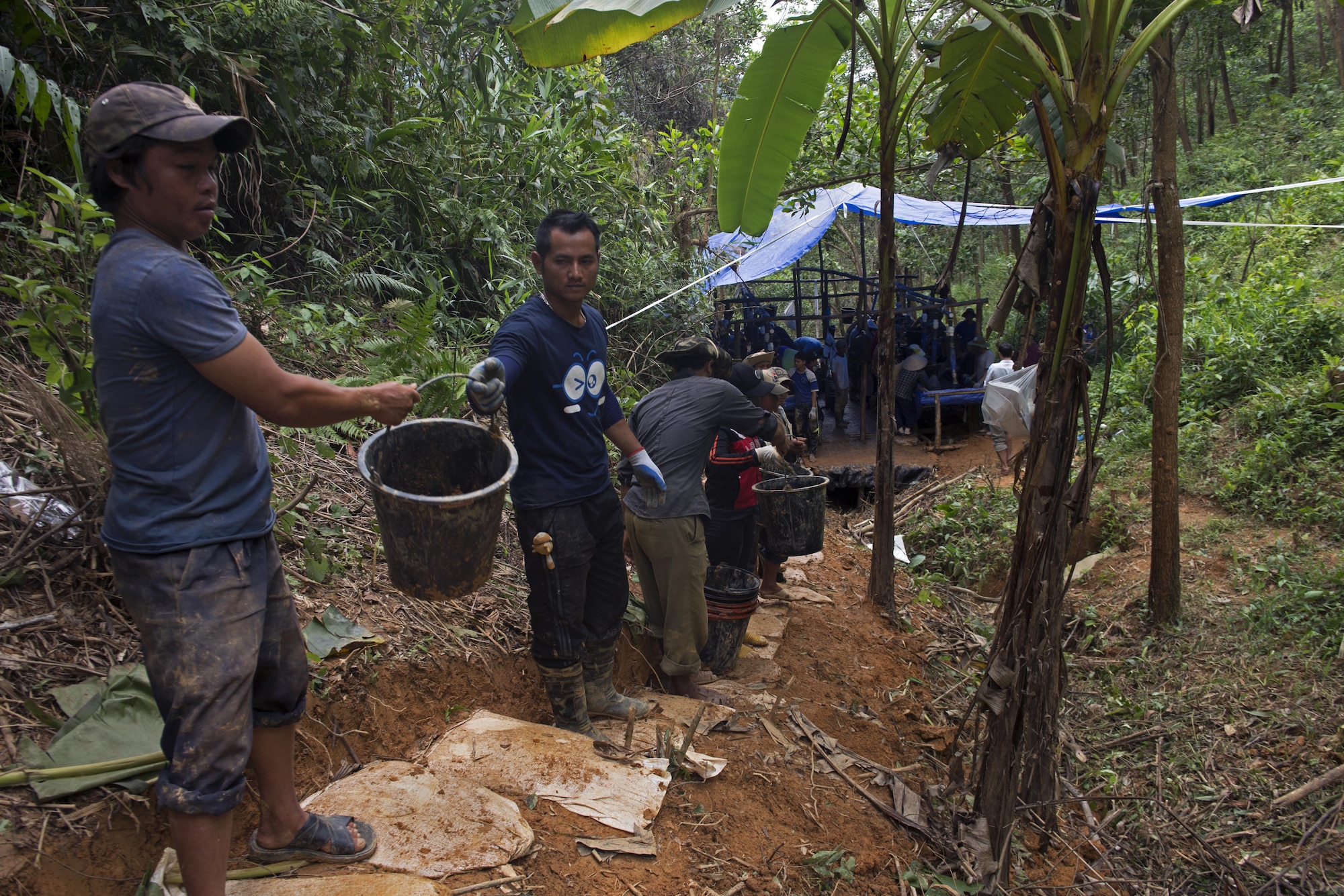 Vietnamese personnel transport soil during a recovery operation with members from the Defense POW/MIA Accountability Agency in Phuoc Son providence, Vietnam, May 27, 2017. DPAA team members deployed to the area in hopes of recovering the remains of a service member unaccounted for from the Vietnam conflict. (U.S. Air Force photo by Staff Sgt. David Owsianka) 