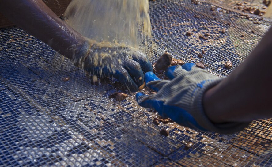 Vietnamese personnel screen soil as they work alongside Defense POW/MIA Accountability Agency members in hopes of recovering parts from a fallen aircraft or service member in Phuoc Son providence, Vietnam, May 27, 2017. The mission of DPAA is to provide the fullest possible accounting for our missing personnel to their families and their nation. (U.S. Air Force photo by Staff Sgt. David Owsianka) 