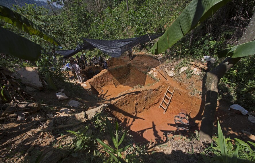 Members of the 17-3VM Recovery Team, deployed by Defense POW/MIA Accountability Agency (DPAA), excavate soil from a unit as part of a recovery mission in Phuoc Son providence, Vietnam, June 3, 2017. Since 1973, the remains of more than 1,000 Americans killed in the Vietnam War have been identified and returned to their families for a proper burial with full military honors. (U.S. Air Force photo by Staff Sgt. David Owsianka) 