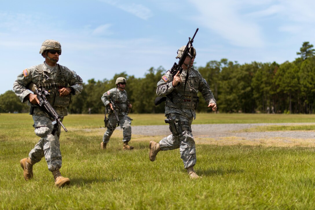 Guardsmen rush to the next firing objective during the 46th Winston P. Wilson Championships at the National Guard Marksmanship Training Center in North Little Rock, Ark., July 24, 2017. Army photo by Staff Sgt. Jeremiah Runser 