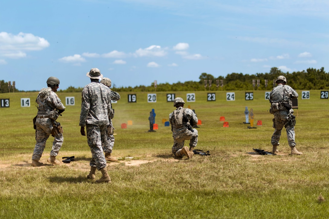 Guardsmen fire weapons at targets while competing in the 46th Winston P. Wilson Championships at the National Guard Marksmanship Training Center in North Little Rock, Ark., July 25, 2017. Army photo by Staff Sgt. Jeremiah Runser