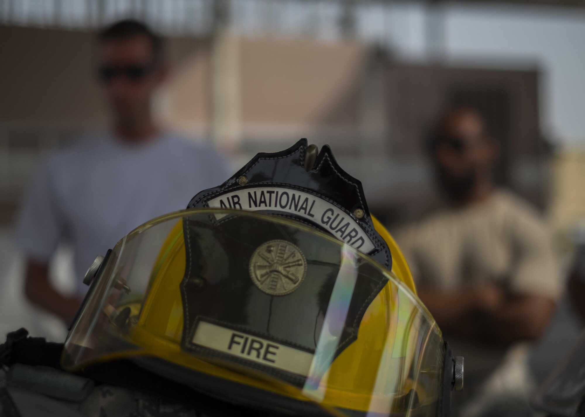 Airmen stand ready for bunker drills during Fire Immersion Training July 28, 2017, Al Dhafra Air Base, United Arab Emirates. Training provided Airmen from around the installation with a hands-on perspective of what it takes to be a firefighter. (U.S. Air Force photo by Senior Airman Preston Webb)