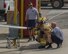 Staff Sgt. Brian, right, 380th Expeditionary Civil Engineer Squadron Fire Department firefighter, shows Airmen how safely spray a firehose during Fire Immersion Training July 28, 2017, Al Dhafra Air Base, United Arab Emirates. Throughout the day, Airmen faced several challenges they might experience as firefighters. (U.S. Air Force photo by Senior Airman Preston Webb)
