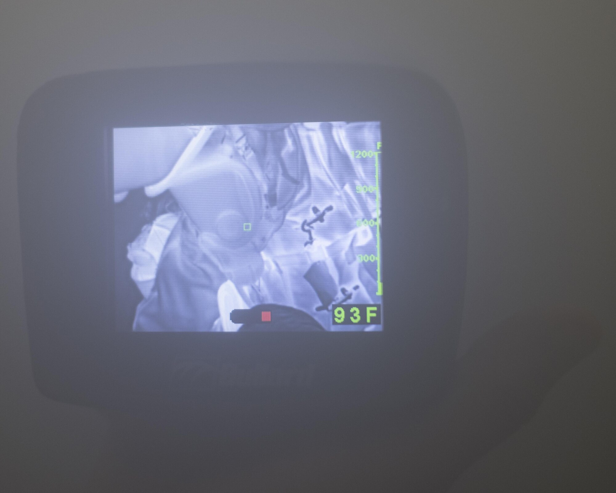 A Thermal Imaging Camera displays Airmen navigating a simulated fire during Fire Immersion Training July 28, 2017, Al Dhafra Air Base, United Arab Emirates. While in full personal protective equipment, Airmen entered a dense smoke to retrieve a simulated casualty. (U.S. Air Force photo by Senior Airman Preston Webb)
