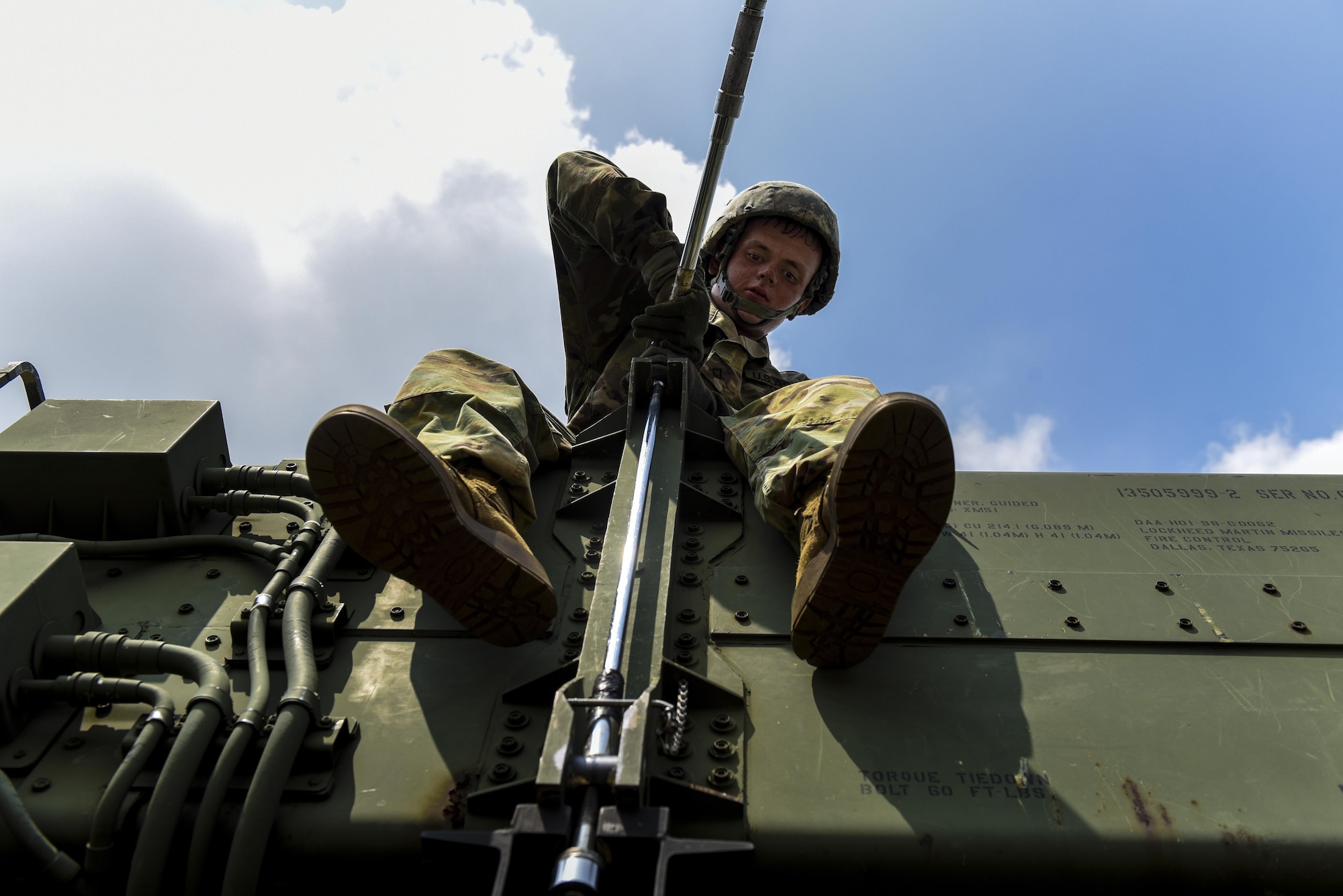 U.S. Army Pfc. Tyler Ankele, Alpha Battery, 2nd Battalion, 1st Air Defense Artillery Regiment patriot missile operator and maintainer, tightens a bolt during patriot missile system reload training at Kunsan Kunsan Air Base, Republic of Korea, July 27, 2017. Members of A/2-1 conducted training on operation, manning, sustainment, and employment of the Patriot Weapons system. (U.S. Air Force photo by Senior Airman Michael Hunsaker/Released).  