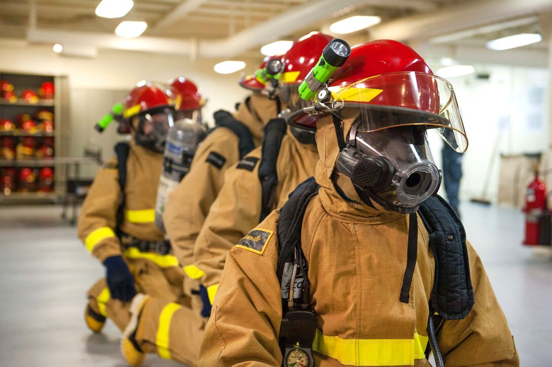 Sailors await orders before participating in a simulated general quarters drill aboard the amphibious assault ship USS America in the Pacific Ocean, July 24, 2017. Navy photo by Petty Officer 2nd Class Alexander A. Ventura II