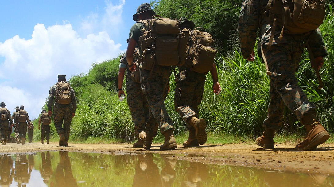 Lance Cpl. Jeanette E. Fernando and other Marines with Marine Light Attack Helicopter Squadron 169, hike towards the Iwo Jima memorial site on Mt. Suribachi, Iwo Jima, Japan, July 26, 2017. Fernando and other Marines in her squadron were given the opportunity to revisit the battlegrounds at which Fernando's grandfather, a Navajo Code Talker, fought during World War II. Fernando is an airframe mechanic assigned to HMLA-169, Marine Aircraft Group 39, 3rd Marine Aircraft Wing, currently on a unit deployment program with 1st MAW based in Okinawa, Japan. (U.S. Marine Corps photo by Sgt. Laura Gauna)