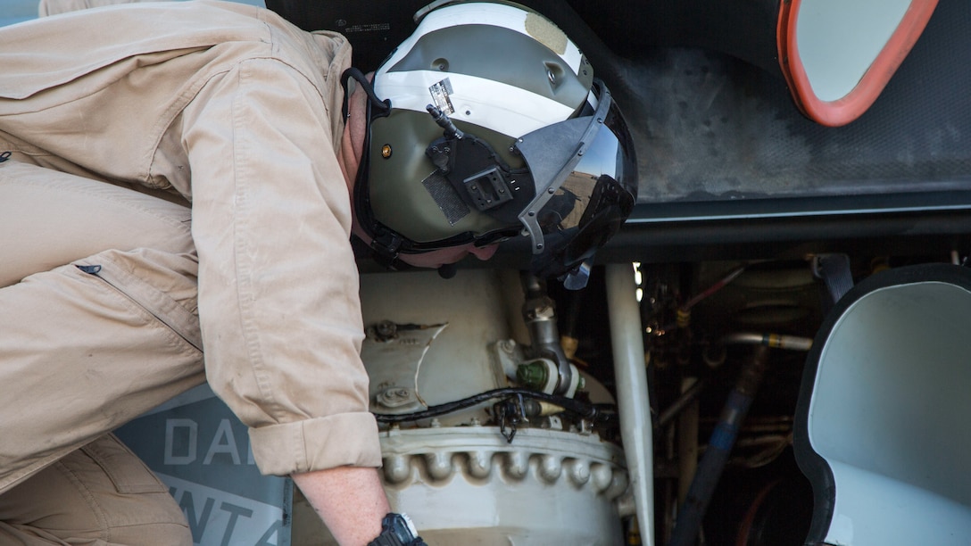 A U.S. Marine UH-1Y Huey helicopter mechanic with Marine Light Attack Helicopter Squadron 167, Marine Air Ground Task Force 8 (MAGTF) conducts pre-operation flight checks on a UH-1Y Huey Helicopter before beginning a close air support drill during Integrated Training Exercise (ITX) 5-17 at Marine Corps Air Ground Combat Center, Twentynine Palms, Calif., July 21, 2017. The purpose of ITX is to create a challenging, realistic training environment that produces combat-ready forces capable of operating as an integrated MAGTF. (U.S. Marine Corps Photo by Sgt. Kassie L. McDole)