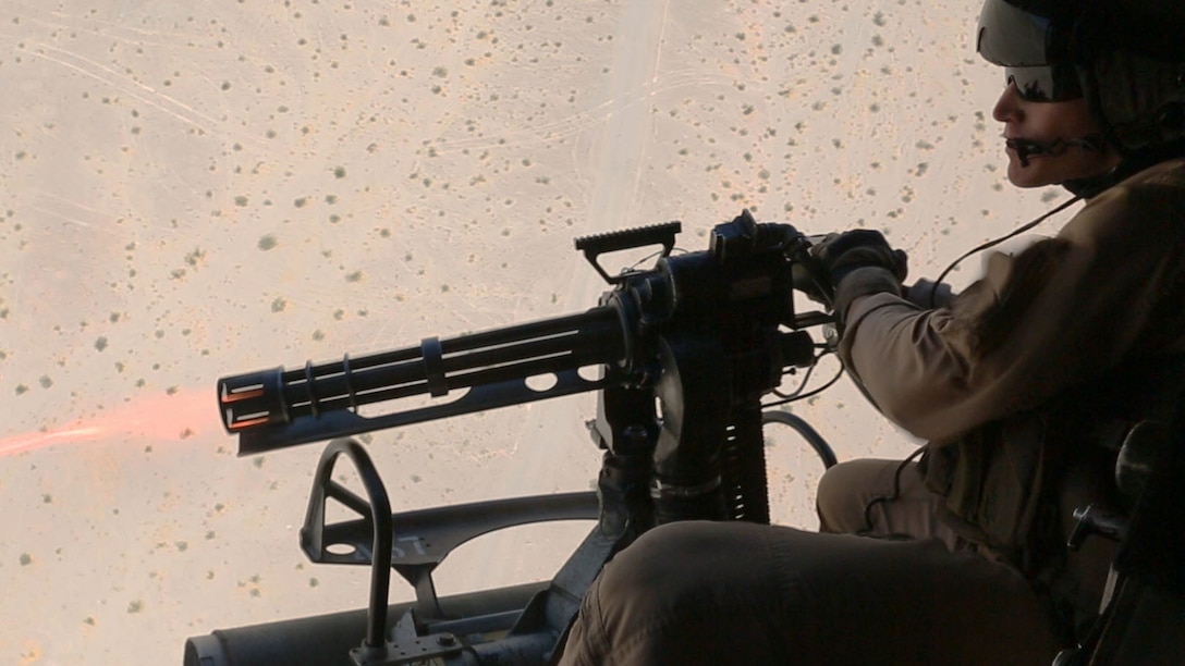 U.S. Marine Corps Staff Sgt. Dustin S. Miller, Crew Chief with Marine Light Attack Helicopter Squadron 167, Marine Air Ground Task Force 8 (MAGTF) fires a GAU-17/A mini-gun from a UH-1Y Huey Helicopter while conducting a close air support drill during Integrated Training Exercise (ITX) 5-17 at Marine Corps Air Ground Combat Center, Twentynine Palms, Calif., July 21, 2017. The purpose of ITX is to create a challenging, realistic training environment that produces combat-ready forces capable of operating as an integrated MAGTF. (U.S. Marine Corps Photo by Sgt. Kassie L. McDole)