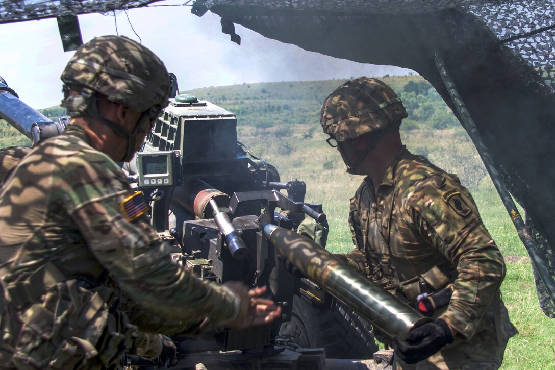 Paratroopers prepare to load a round into a 119A3 howitzer during a live-fire, part of exercise Saber Guardian near Turzii, Romania, July 24, 2017. Army photo by Spc. Cheyenne Shouse