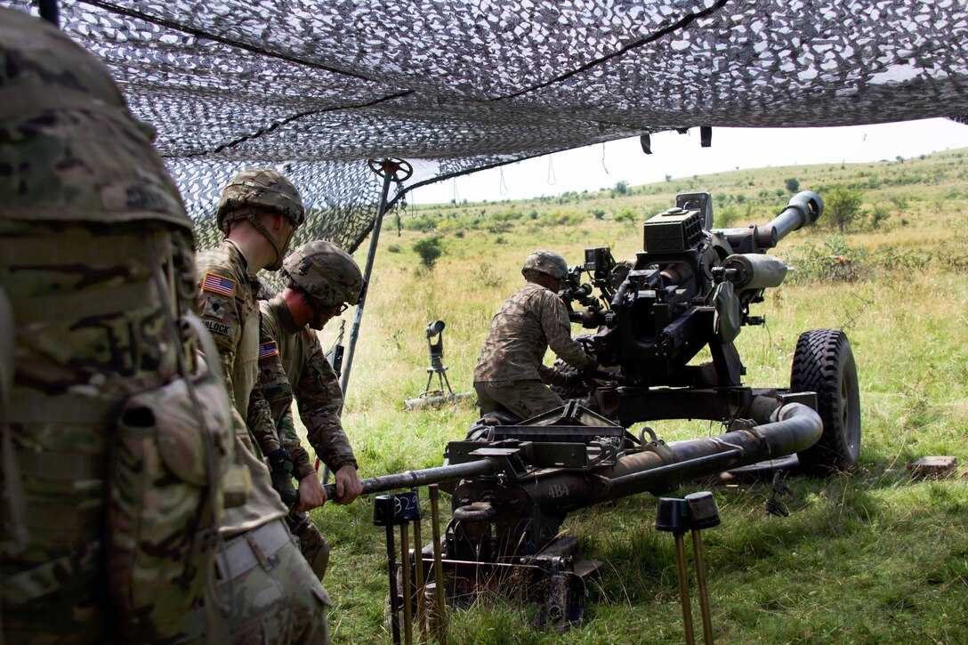 Paratroopers reposition a 119A3 howitzer during a live-fire, part of exercise Saber Guardian near Turzii, Romania, July 24, 2017. Army photo by Spc. Cheyenne Shouse