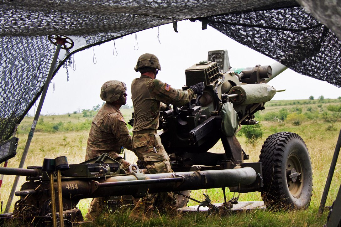 Paratroopers prepare to fire a 119A3 howitzer during a live-fire, part of exercise Saber Guardian near Turzii, Romania, July 24, 2017. Army photo by Spc. Cheyenne Shouse