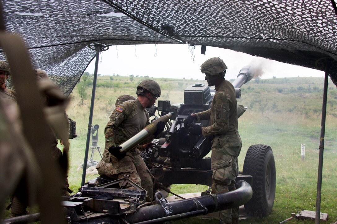 Paratroopers prepare to reload a round into a 119A3 howitzer during a live-fire, part of exercise Saber Guardian near Turzii, Romania, July 24, 2017. Army photo by Spc. Cheyenne Shouse