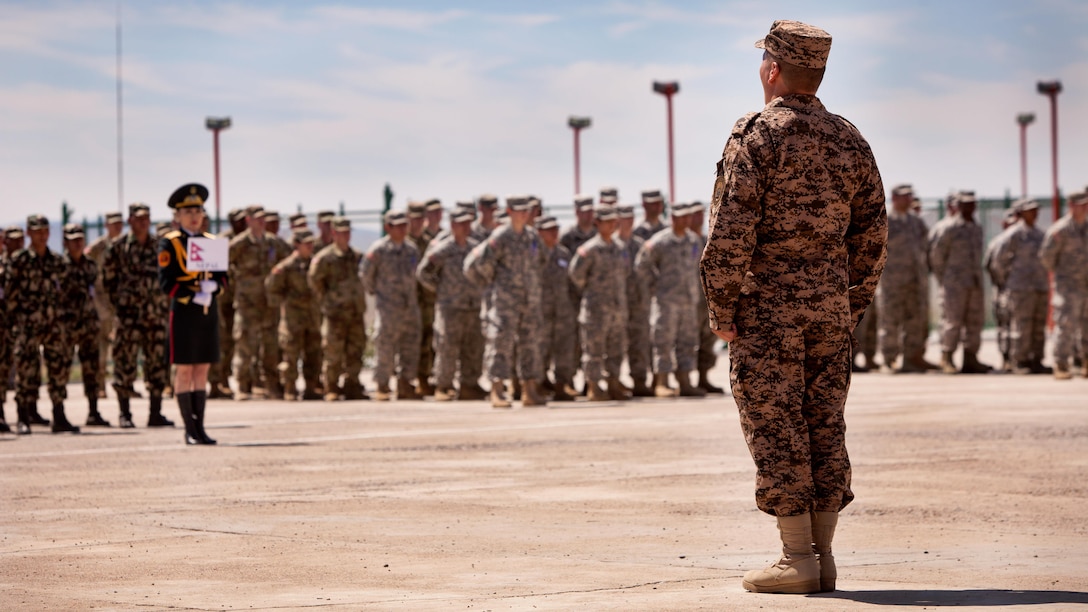 Service members of partnered nations stand in formation during the Khaan Quest 2017 opening ceremony at Five Hills Training Area, Mongolia, July 23, 2017. Khaan Quest 2017 is a Mongolian-hosted, combined, joint training exercise designed to strengthen the capabilities of the U.S., Mongolia and other partner nations in international peacekeeping operations.(U.S. Marine Corps photo by Lance Cpl. Maximiliano Rosas)