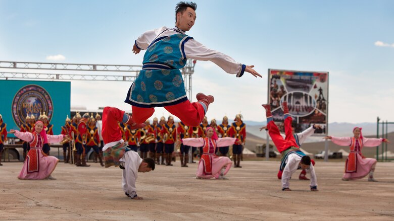 The Mongolian Military Dance and Song Ensemble perform traditional Mongolian dancing after the opening ceremony of Exercise Khaan Quest 2017 at Five Hills Training Area, Mongolia, July 23, 2017. Khaan Quest 2017 is a Mongolian-hosted, combined, joint training exercise designed to strengthen the capabilities of the U.S., Mongolia and other partner nations in international peacekeeping operations.(U.S. Marine Corps photo by Lance Cpl. Maximiliano Rosas)