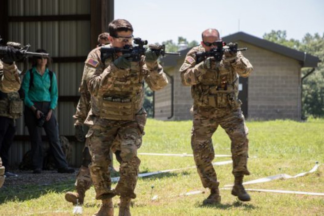 House Speaker Paul Ryan and Division Commander Maj. Gen. Andrew Poppas practice room clearing as part of a close quarter battle exercise at Fort Campbell, Ky., July 10, 2017. Army photo by Spc. Patrick Kirby