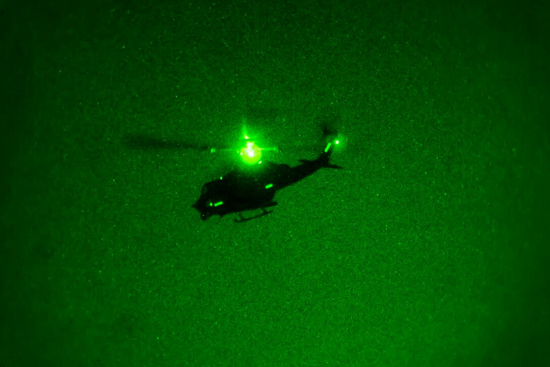 An AH-1W Super Cobra aircraft with Marine Medium Tiltrotor Squadron (VMM) 162 (Reinforced), 26th Marine Expeditionary Unit (MEU) conducts night flight operations during Amphibious Squadron (PHIBRON)-MEU Integration Training (PMINT) off the North Carolina coast, July 13, 2017. PMINT allows the Navy-Marine Corps team to improve interoperability and exercise the unique capabilities of the Amphibious Task Force. 