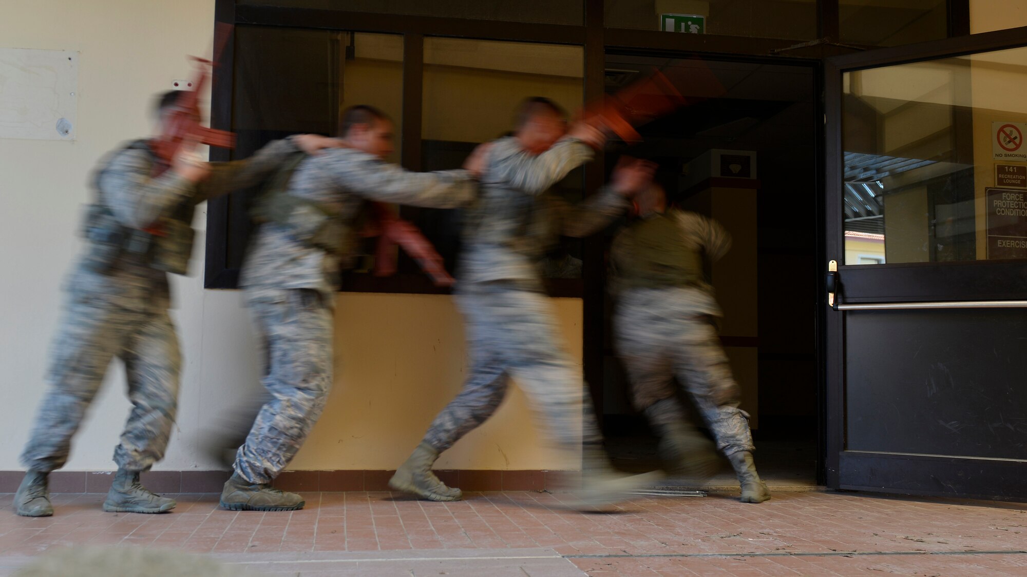 Airmen from the 31st Security Forces Squadron enter a room during close-quarters battle training, July 27, 2017, at Aviano Air Base, Italy. The defenders learned how to work together in small teams to secure an area from enemy threats. (U.S. Air Force photo by Senior Airman Cary Smith)