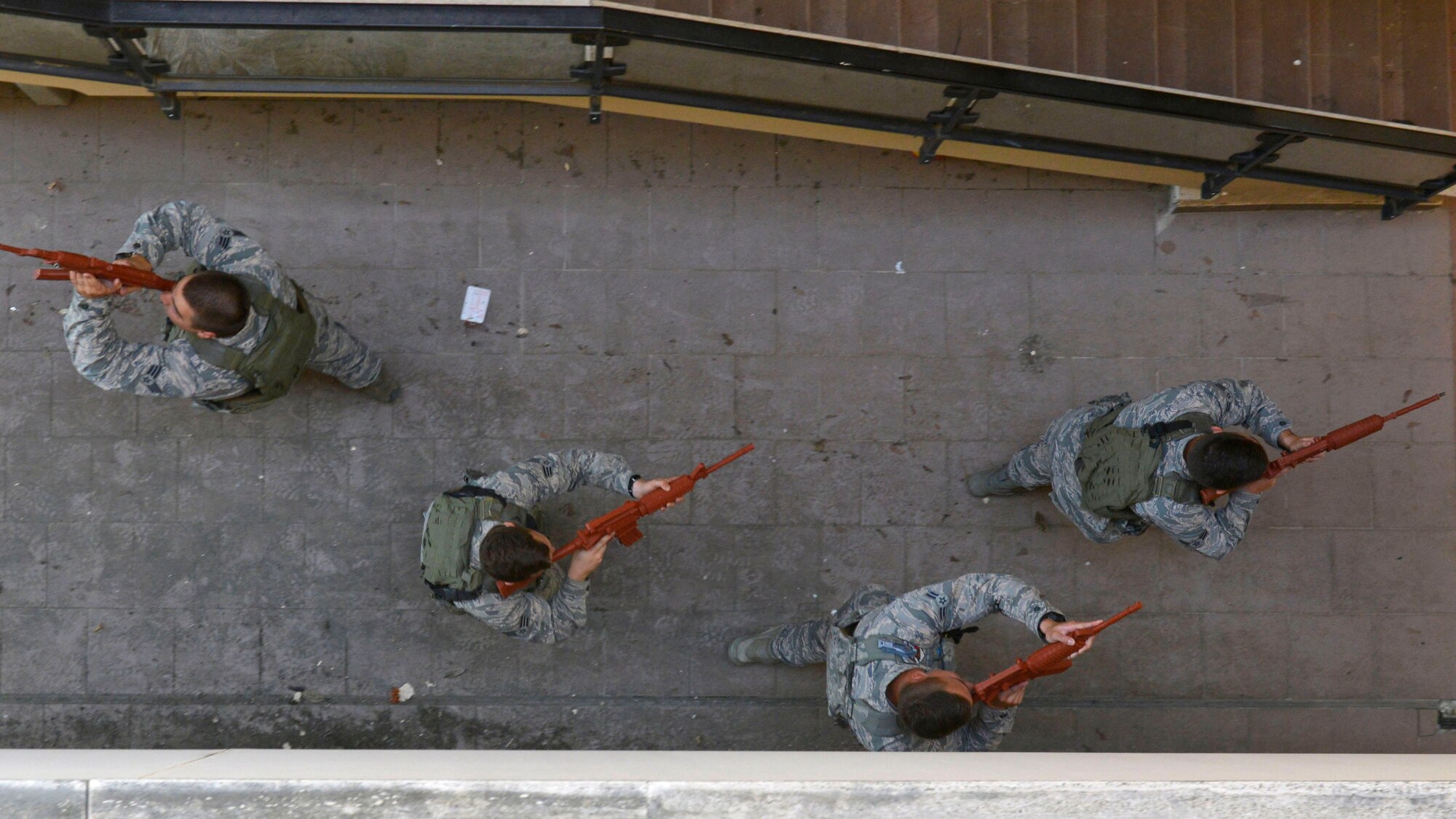 Airmen from the 31st Security Forces Squadron secure an entryway during close-quarters battle training, July 27, 2017, at Aviano Air Base, Italy. During the training, defenders worked in small groups to safely secure rooms from enemy threats. (U.S. Air Force photo by Senior Airman Cary Smith)