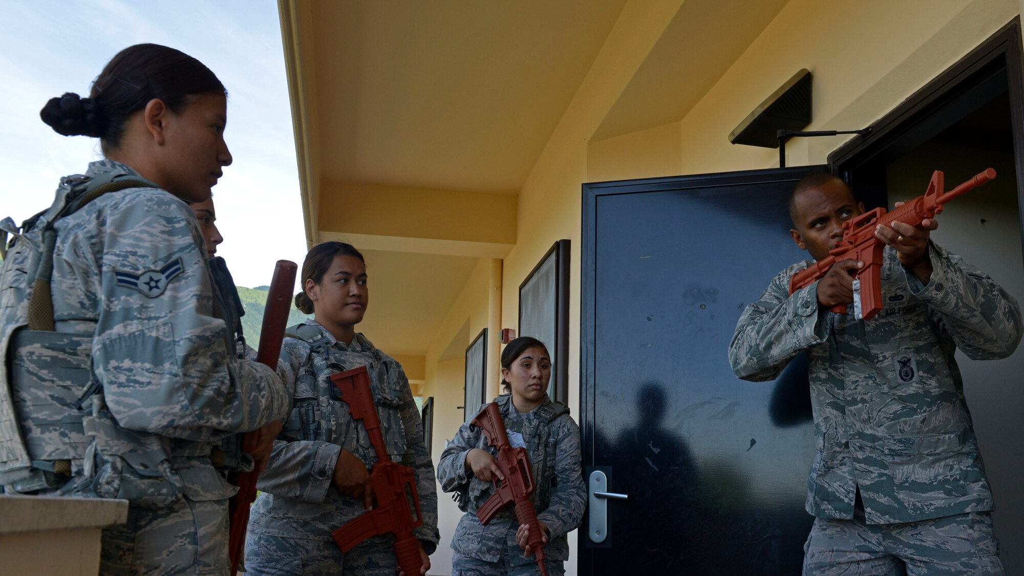 Staff Sgt. Raymond Duesbury, 31st Security Forces Squadron training instructor (right), instructs  Airmen on how to provide security coverage during close-quarters battle training, July 27, 2017, at Aviano Air Base, Italy. During the training, defenders worked in small groups to safely secure rooms from enemy threats. (U.S. Air Force photo by Senior Airman Cary Smith)