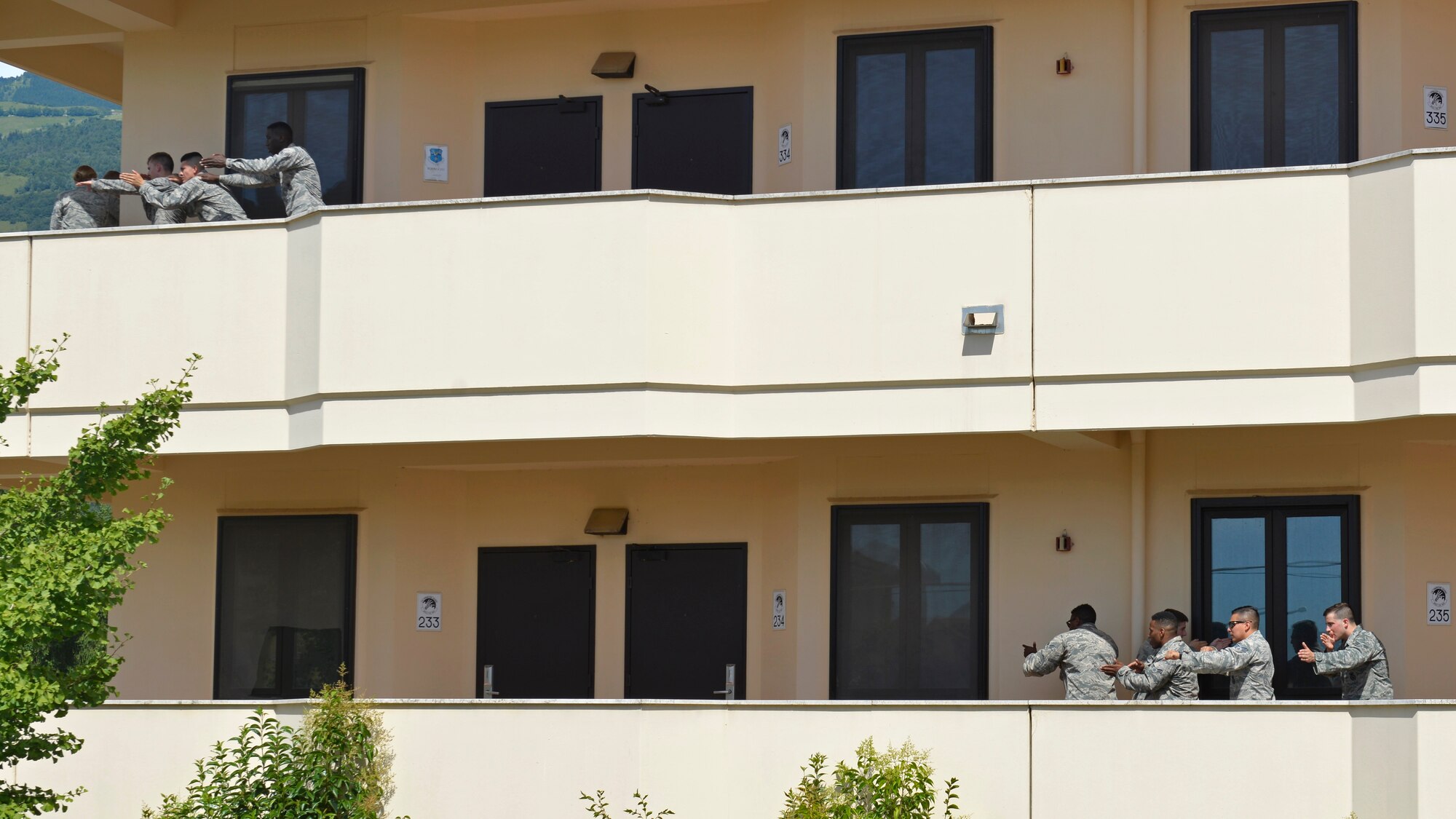 Two 31st Security Forces Squadron security response teams practice how to safely enter a room during close-quarters battle training, July 27, 2017, at Aviano Air Base, Italy. The hands-on training provided Airmen with an understanding of hostile, close-quarters environments in order to prepare for real-life scenarios. (U.S. Air Force photo by Senior Airman Cary Smith)