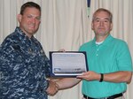 CDSA Dam Neck Commanding Officer Cmdr. Andrew J. Hoffman presents a $50 on-the-spot award to Mr. Roger Messer of CDSA’s Information Management branch for his contributions to High Velocity Learning at the command. 