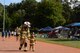 U.S. Air Force Master Sgt. Michael Ott, Air Force Installation and Mission Support Center Detachment 4 fire emergency services program manager, and his son, Aaron, run a lap during the 11th Annual Kaiserslautern Military Community Viking Challenge on Vogelweh Military Complex, Germany, July 28, 2017. Approximately 600 participants came to walk, run, and camp during the 24-hour run and walk-a-thon. (United States Air Force photo by Airman 1st Class Milton Hamilton Jr.)