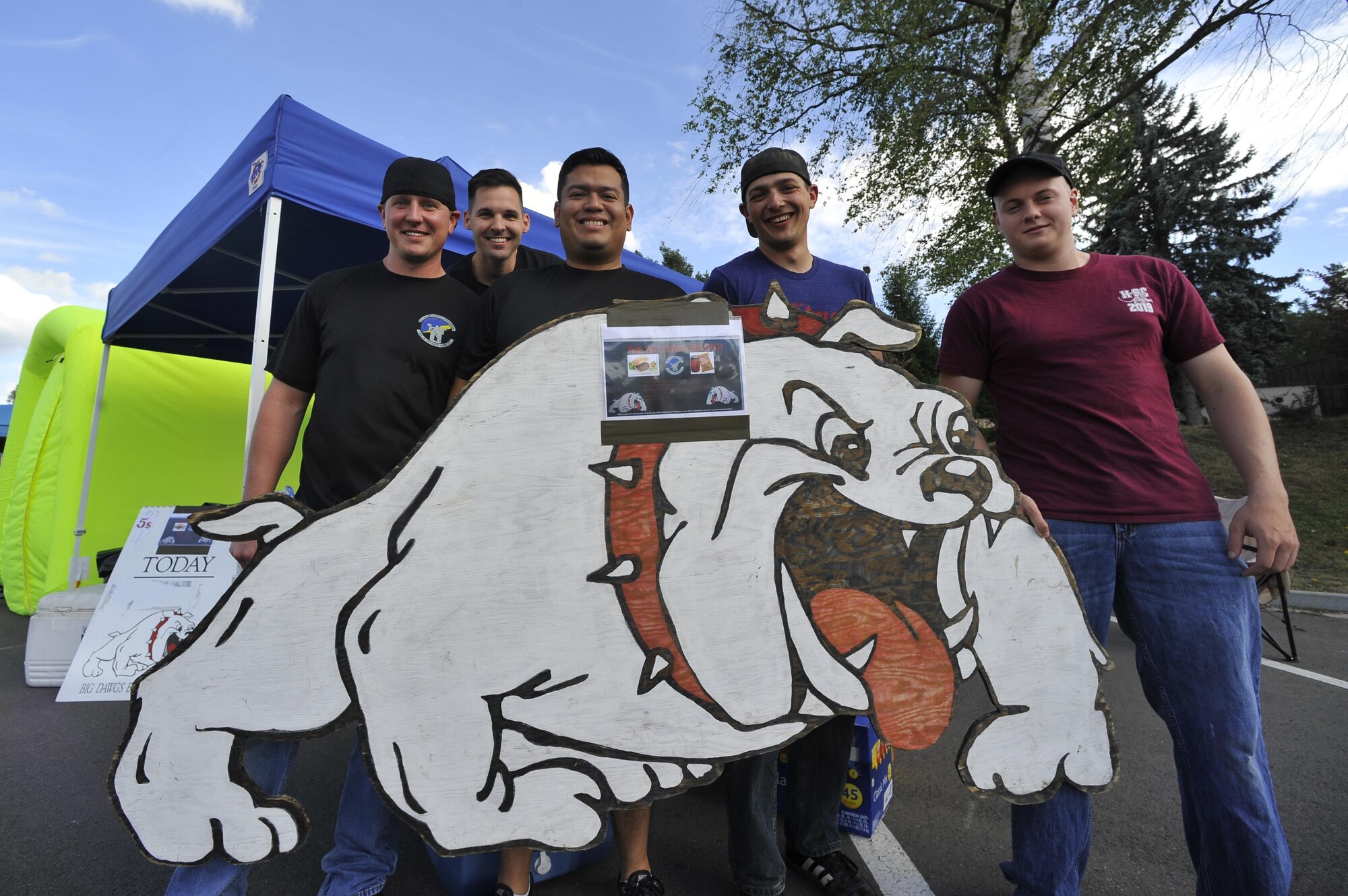 U.S. Airmen assigned to the 86th Maintenance Squadron pose for a photo during the 11th Annual Kaiserslautern Military Community Viking Challenge on Vogelweh Military Complex, Germany, July 28, 2017. The 86th MXS booster club represented one of the 13 private organizations within the KMC who provided food during the event. (United States Air Force photo by Airman 1st Class D. Blake Browning)