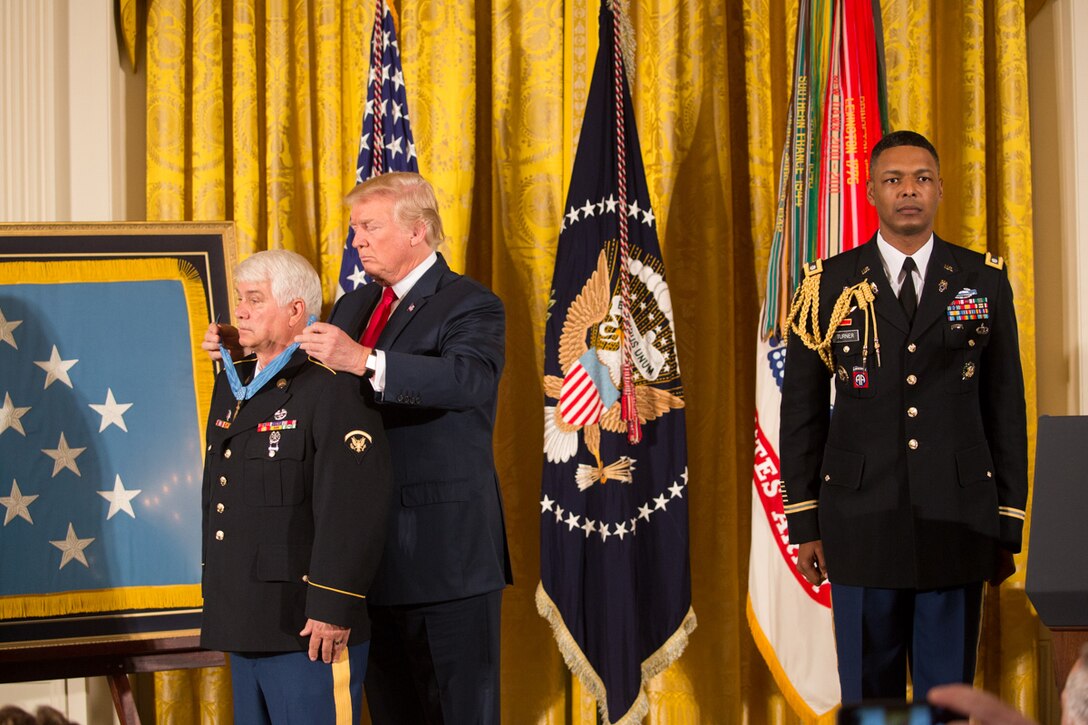 President Donald J. Trump presents the Medal of Honor to former Army Spc. 5 James C. McCloughan during a ceremony at the White House in Washington, July 31, 2017. White House photo