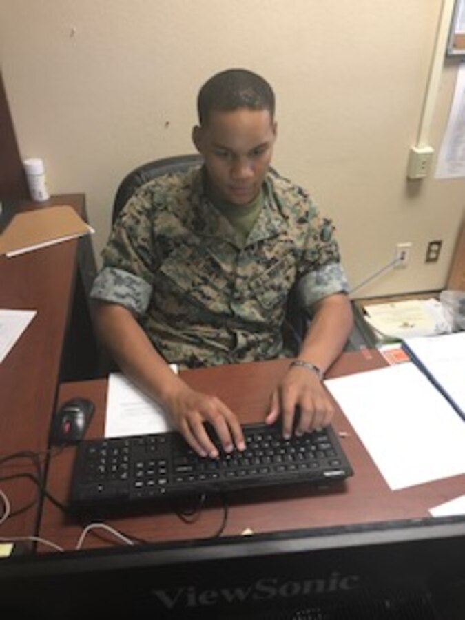 Cpl James W. Holiday II of Headquarters Company, Marine Corps Communication-Electronics School works vicariously to process awards for approval. Cpl Holiday additionally serves as the DTS NCO for the Group Administration Section.