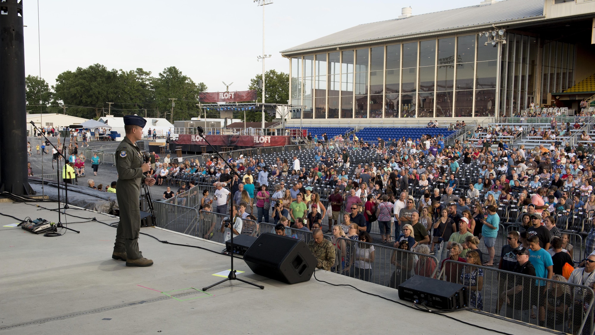 Col. Craig Peters, 512th Airlift Wing commander, speaks prior to concert on Military Appreciation Day at the Delaware State Fair July 26, 2017, in Harrington, Del. The 512th AW is the Air Force Reserve mission partner based at Dover Air Force Base, Del. (U.S. Air Force photo by Senior Airman Zachary Cacicia)