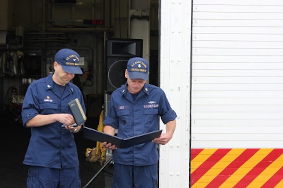 MK1 John Cole, USCG Ret., receives a Coast Guard Commendation Medal prior to retiring. 