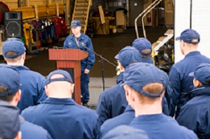 CAPT Jason Hamilton addresses crew members during the memorial ceremony.