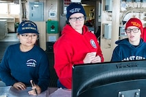 SN Julie Nguyen, OSC Nicole Clark, and ENS Nickolette Morin on the bridge. 