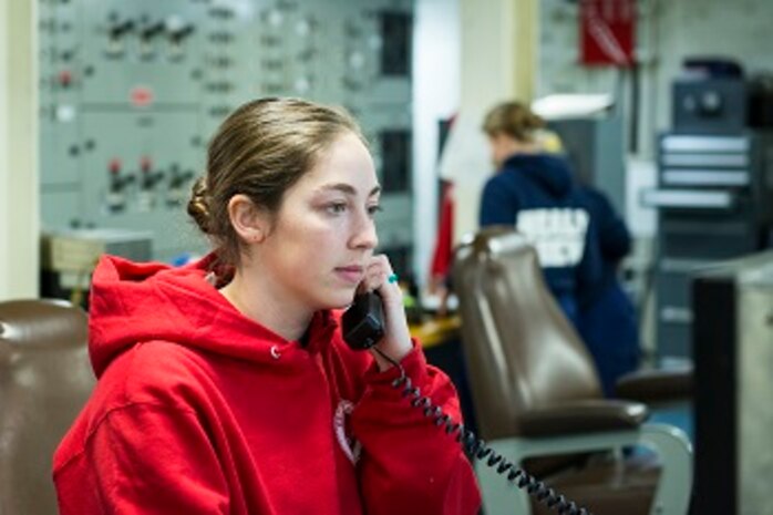 ENS Abby Isaacs standing Engineer of the Watch (EOW) in main control. 