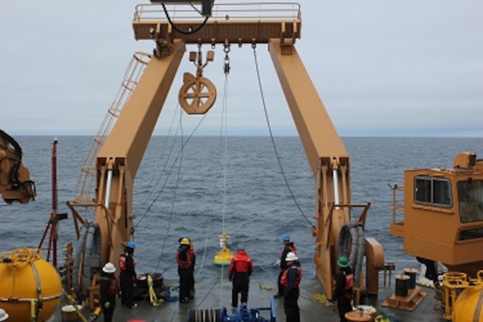 The Deck Department observes gear deployed from the aft a-frame. 