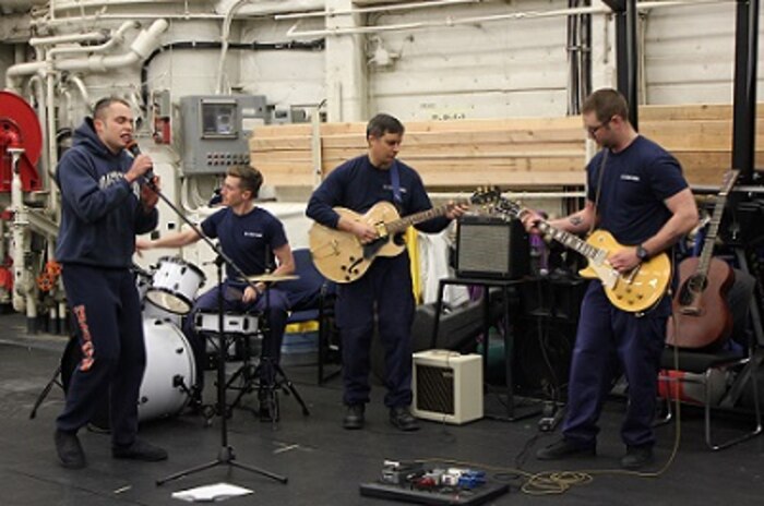 Ol' Dirty Plaster and the Navi-Knots perform in the hangar on Labor Day. 