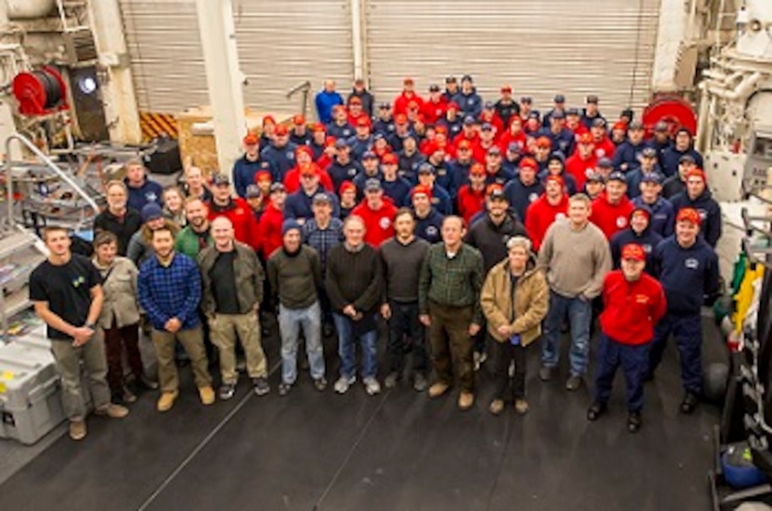 The crew and embarked science party gather for the AWS-1602 mission photo.