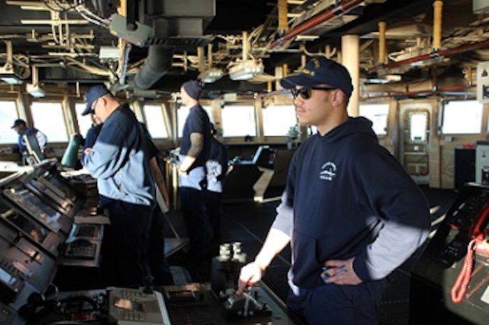 ENS Chris DiBari conns HEALY during an anchorage.