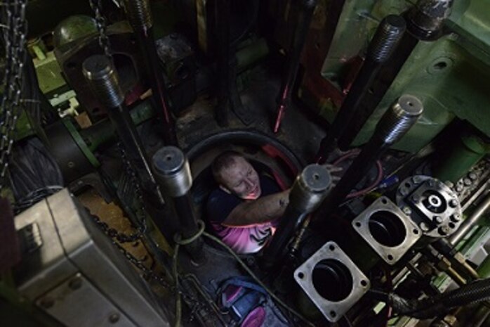 MK2 Jeff Bernard conducts repairs on the #3 main diesel engine.