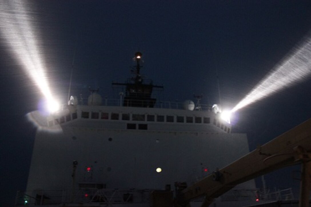 HEALY operating in the ice at night using searchlights.