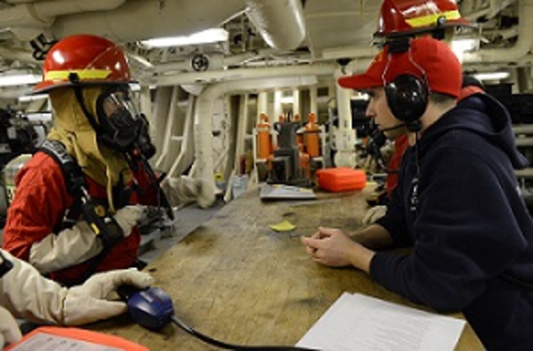 DCC Dave Warner conducts training with members of HEALY’s fire team.