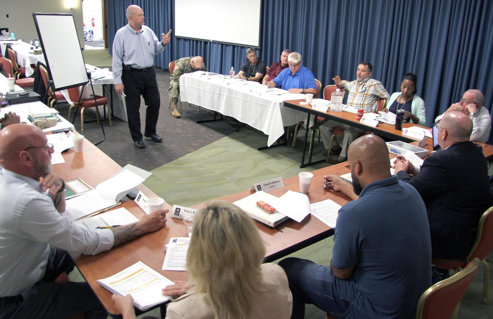 Force Protection officers participate in a table top discussion during a force protection and anti-terrorism workshop hosted by U.S. Army North at the Fort Sam Houston Community Center at Joint Base San Antonio-Fort Sam Houston July 25-28. More than 60 force protection personnel from 21 commands, including Air Force, Navy and Marines attended the week-long workshop to discuss changes and improvements. The workshop brought force protection leaders from other installations together to discuss current trends and future strategies on improved methods and changes for security of Army facilities, Soldiers and their families and Department of Defense civilians.  
