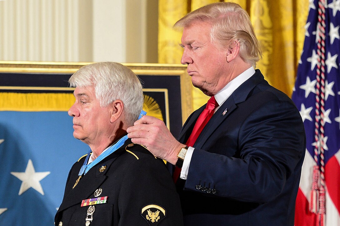 President Donald J. Trump presents the Medal of Honor to former Army Spc. 5 James C. McCloughan at the White House in Washington, July 31, 2017. McCloughan was awarded the Medal of Honor for distinguished actions as a combat medic during the Vietnam War.  Army photo by Eboni Everson-Myart