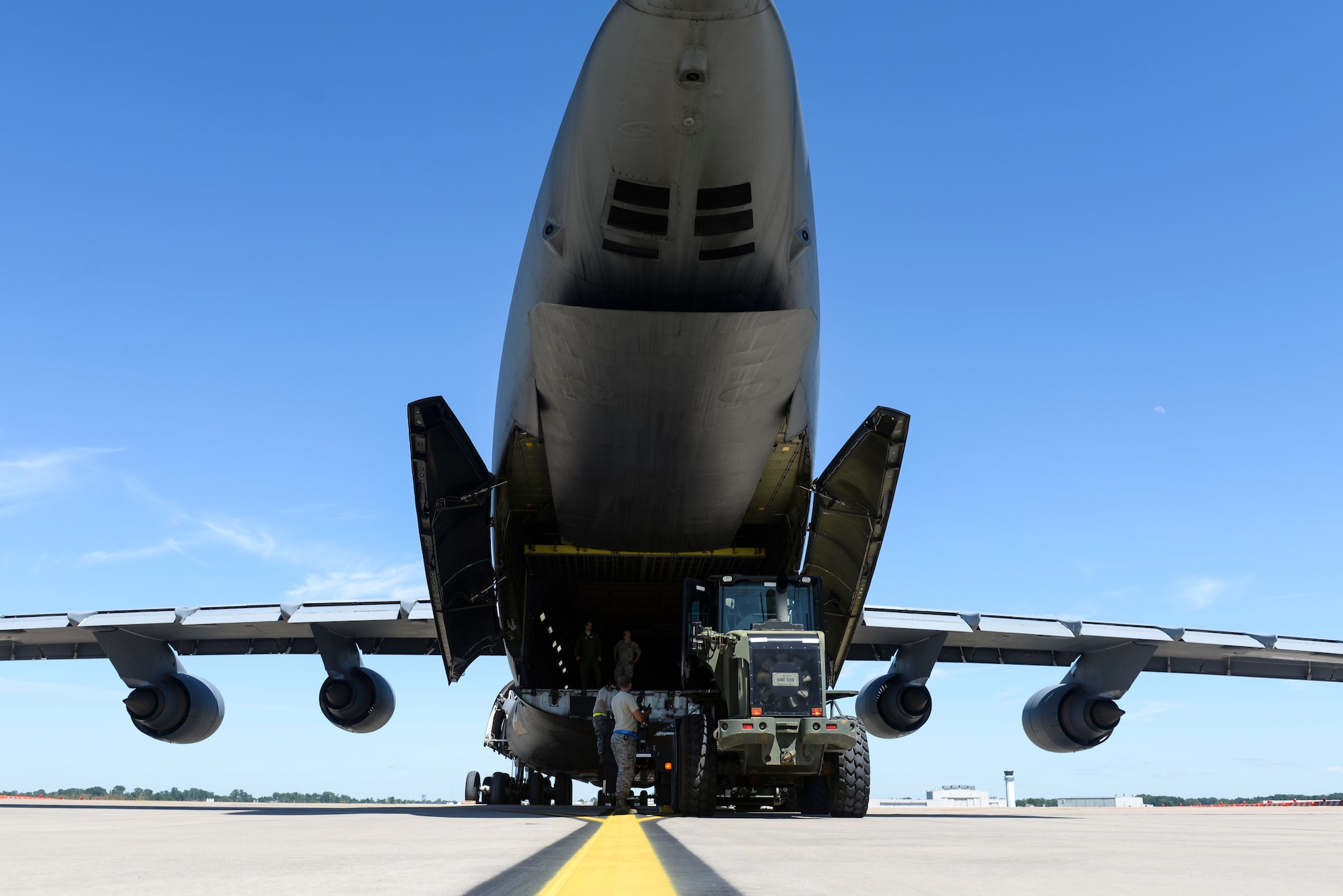 Team Little Rock members offload cargo from a C-5 Galaxy III assigned to Travis Air Force Base, Calif., July 30, 2017, at the Clinton National Airport. The aircraft was loaded in preparation of Mobility Guardian, an exercise featuring more than 3,000 personnel, including 25 international countries. (U.S. Air Force Airman Rhett Isbell)