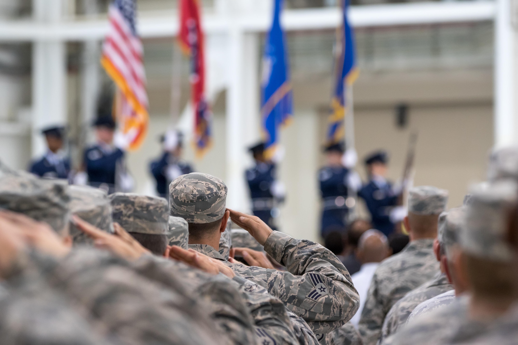 Members of the Tennessee Air National Guard hold a salute during the presentation of the colors by the 164AW Color Guard on Memphis Air National Guard Base. Memphis ANG Base is the first to partner with AFCEC on a UESC. (U.S. Air National Guard Photo by Staff Sgt. Allan Eason/Released)