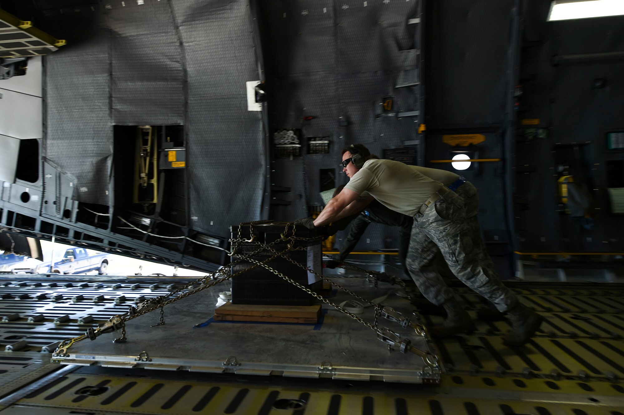 Team Little Rock Airmen offload cargo from a C-5 Galaxy III assigned to Travis Air Force Base, Calif., July 30, 2017. Approximately 90 aircraft are participating in Mobility Guardian at Joint Base Lewis-McChord, Washington. (U.S. Air Force photo by Staff Sgt. Harry Brexel)