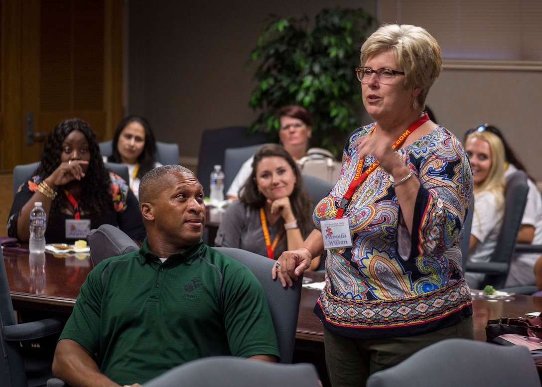 Pamela Wilson, spouse of GySgt Daniel G. Wilson with Recruiting Station Nashville, right, introduces herself during the welcoming brief for the District Spouse Orientation Course (DSOC) at Irby’s Inn aboard Marine Corps Air Station Beaufort, South Carolina, July 25, 2017.  The DSOC provided Marines and their spouses a broad spectrum of tools to help them transition into the Marine Corps’ recruiting field. The spouses came from across the District to build connections and network with fellow spouses. (U.S. Marine Corps photo by Lance Cpl. Jack A. E. Rigsby)