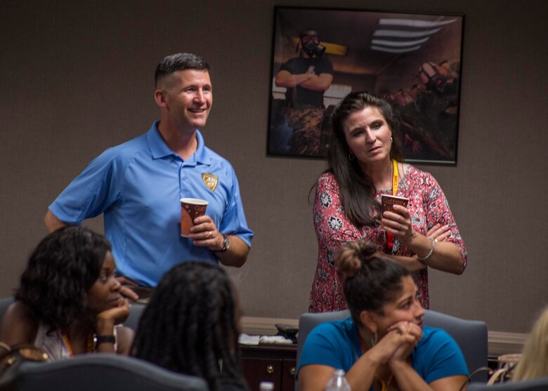 Colonel Jeffery C. Smitherman, Commanding Officer of 6th Marine Corps District (6MCD), left, and his wife, Nagelle Smitherman, right, listen to spouses introduce themselves during the welcoming portion of the District Spouse Orientation Course (DSOC) at Irby’s Inn aboard Marine Corps Air Station Beaufort, South Carolina, July 25, 2017.  The DSOC provided Marines and their spouses a broad spectrum of tools to help them transition into the Marine Corps’ recruiting field. The spouses came from across the District to build connections and network with fellow spouses. (U.S. Marine Corps photo by Lance Cpl. Jack A. E. Rigsby)
