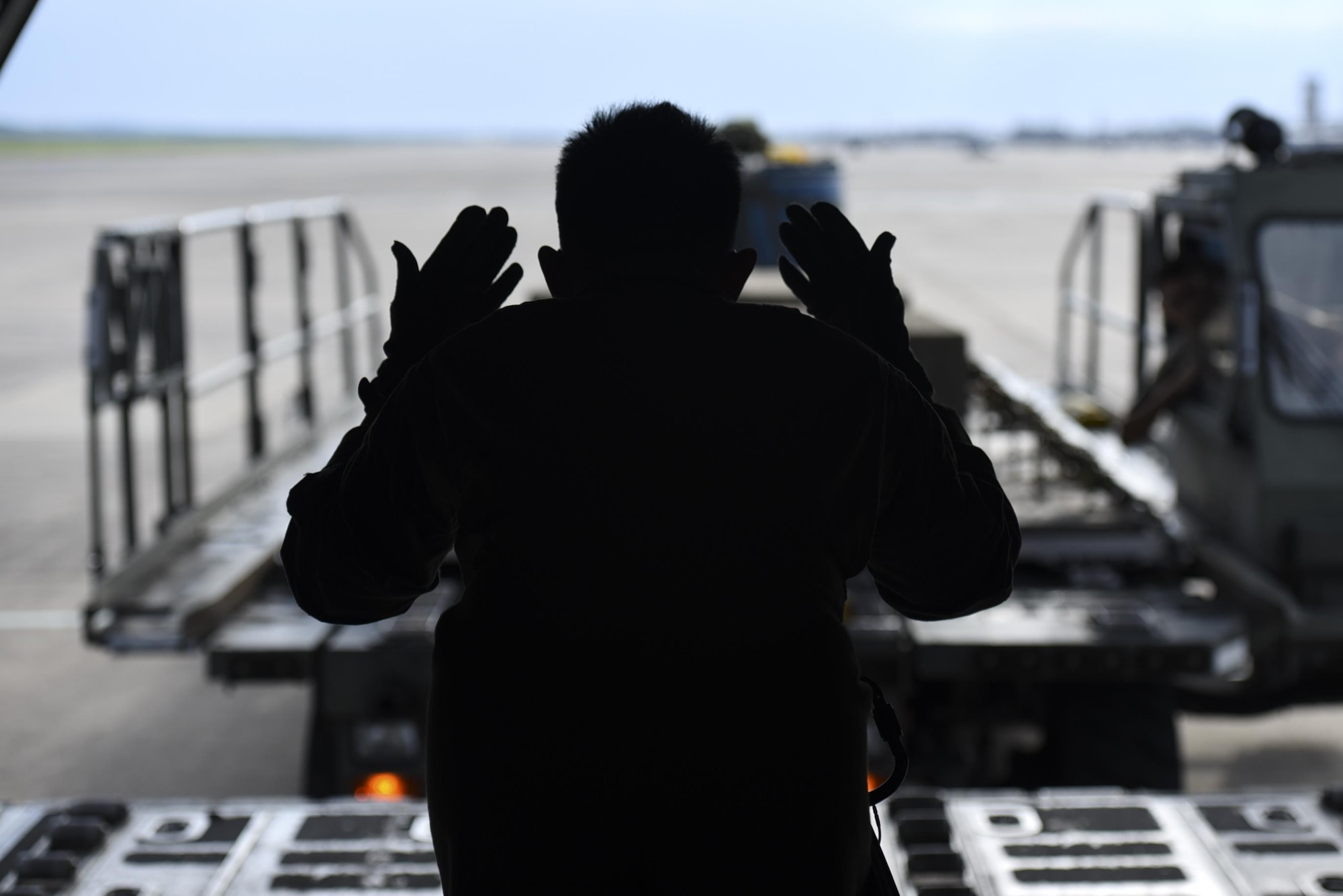 Senior Airman Jaypeter Tuazon, 61st Airlift Squadron loadmaster, loads training weights and a container delivery system onto a C-130J, Aug. 1, 2017, at Little Rock Air Force Base, Ark. Loadmasters manage the loading and offloading of cargo while keeping the aircraft’s weight balanced and within flight limitations.